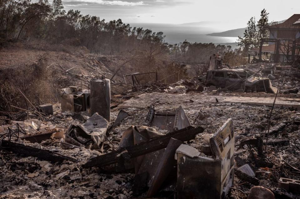 <strong>Ruins of a home in the small hillside town of Kula.</strong> "<a href="https://time.com/6304795/photos-maui-fire-aftermath-climate-change-destruction-resilience/" rel="nofollow noopener" target="_blank" data-ylk="slk:What Remains After the Flames: Scenes From the Ash-Colored Streets of Maui,;elm:context_link;itc:0;sec:content-canvas" class="link ">What Remains After the Flames: Scenes From the Ash-Colored Streets of Maui,</a>" September 4 issue.<span class="copyright">David Butow for TIME</span>