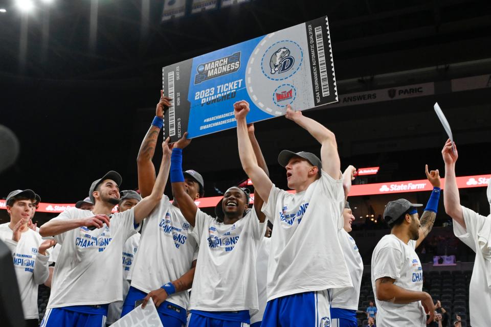 Drake players celebrate after defeating Bradley in the championship game of the Missouri Valley Conference Tournament on March 5.