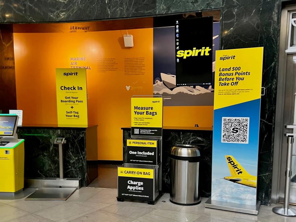 Spirit Airlines bag size-and-weight checkers at LaGuardia Terminal 1.