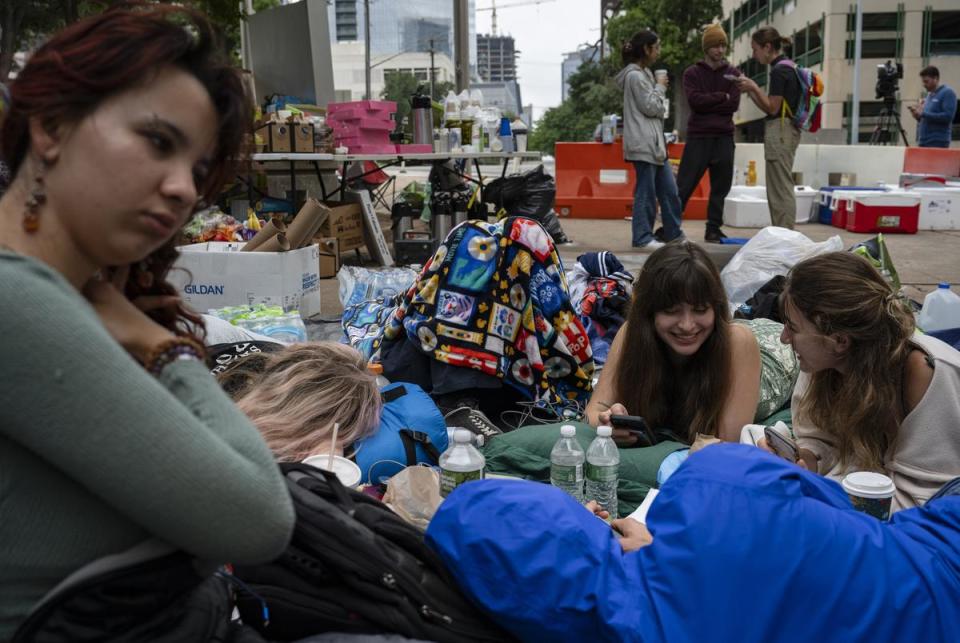 From left, University of Texas at Austin students Ana Maria, Piper Leleus, Daniella Alfonso and Eliza Sommers camp outside of the Travis County Jail as they await the release of pro-Palestinian protesters who were arrested Monday from an encampment on the UT campus on Tuesday, April 30, 2024, in Austin.