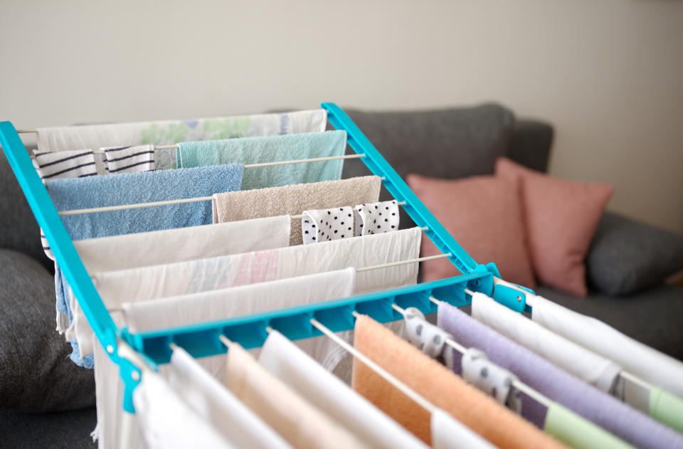 Clothes hung on an indoor clothes drying rack