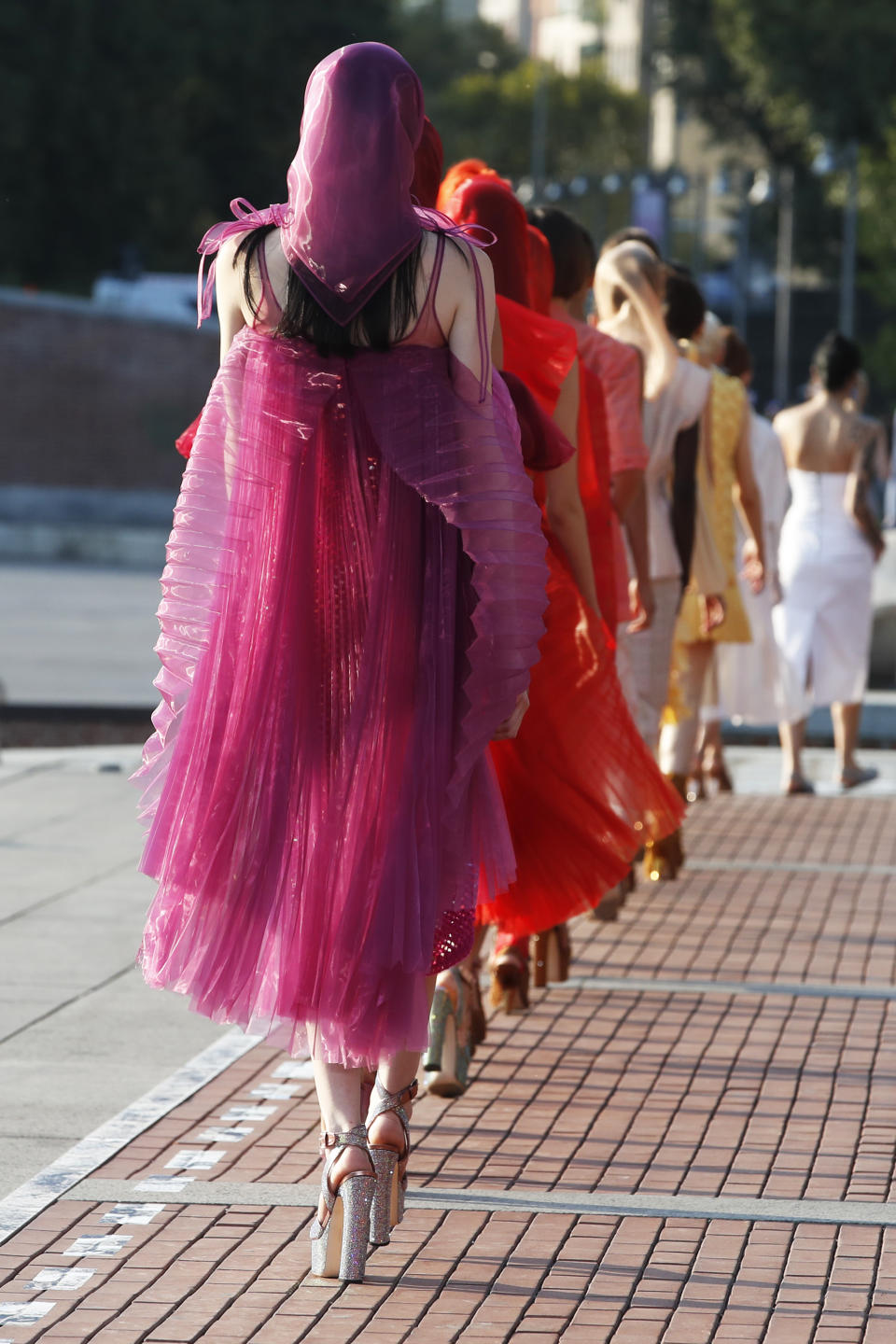 Models wear creations as part of the Marco De Vincenzo Spring-Summer 2020 collection, unveiled during the fashion week, in Milan, Italy, Friday, Sept. 20, 2019. (AP Photo/Antonio Calanni)