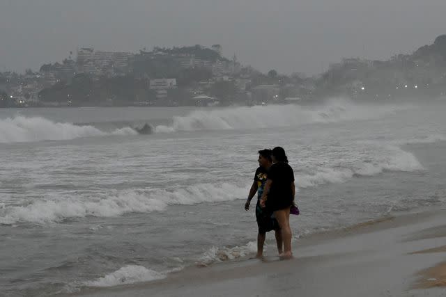 <p>FRANCISCO ROBLES/AFP via Getty</p> Beach in Acapulco, Mexico, ahead of Hurricane Otis' landfall