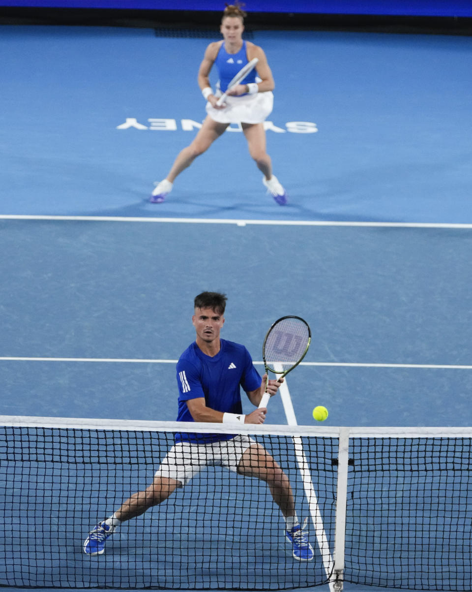 Maria Sakkari and Petros Tsitsipas of Greece in action against Germany's Laura Siegemund and Alexander Zverev during their United Cup doubles quarterfinal tennis match in Sydney, Australia, Friday, Jan. 5, 2024. (AP Photo/Mark Baker)