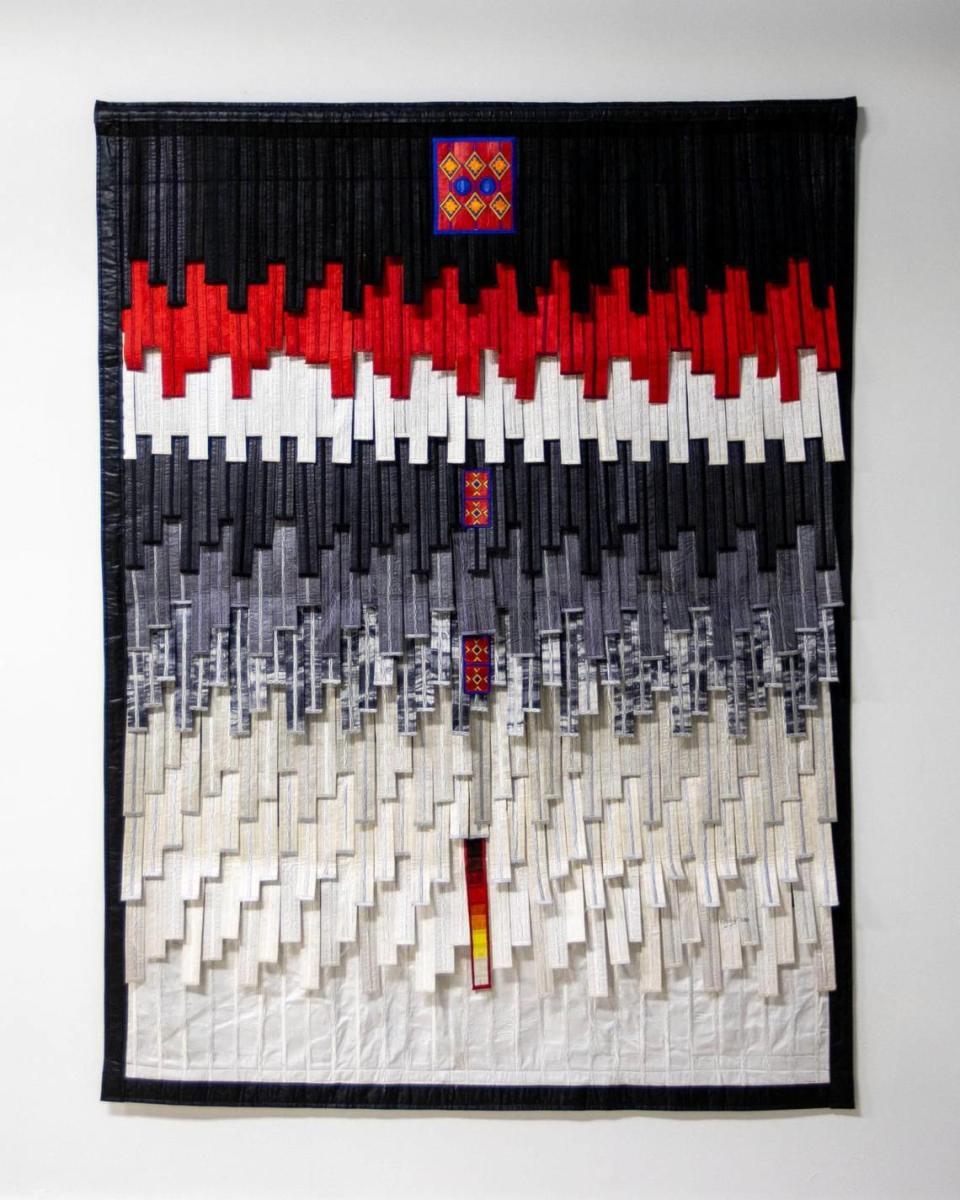 A textile piece by artist Abdoulaye Konaté displayed during the Preview for The Art of Transformation in Opa-locka, Florida, on Wednesday, November 30, 2022. The event is a five-day, two-block event coinciding with Art Basel Miami Beach 2022 and just one of over 40 exhibits part of 2022 Art of Black Miami.