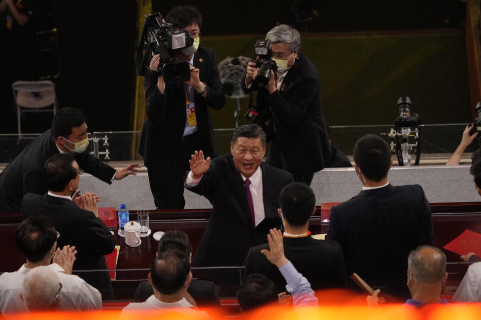 FILE - Chinese President Xi Jinping, center, waves as he attends a gala show ahead of the 100th anniversary of the founding of the Chinese Communist Party in Beijing on June 28, 2021. When Xi Jinping came to power in 2012, it wasn't clear what kind of leader he would be. His low-key persona during a steady rise through the ranks of the Communist Party gave no hint that he would evolve into one of modern China's most dominant leaders, or that he would put the economically and militarily ascendant country on a collision course with the U.S.-led international order. (AP Photo/Ng Han Guan, File)