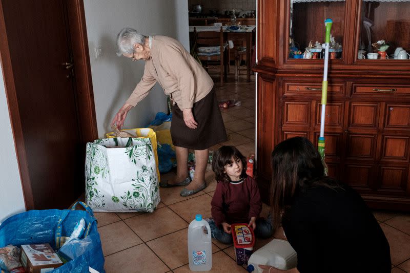 The Wider Image: In Italy, four generations in a coronavirus lockdown