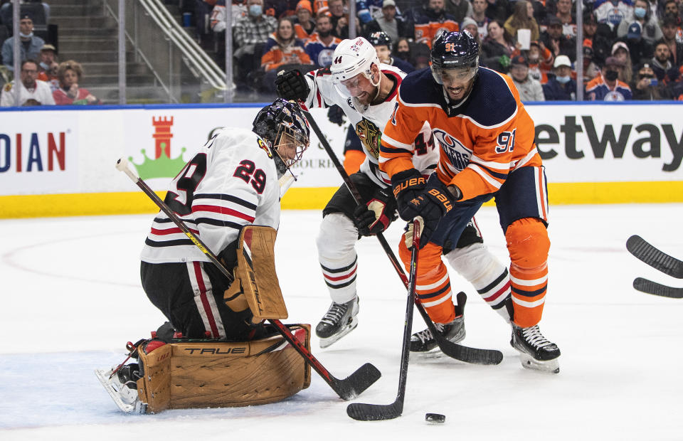 Chicago Blackhawks goalie Marc-Andre Fleury (29) makes a save on Edmonton Oilers' Evander Kane (91) during the second period of an NHL hockey game Wednesday, Feb. 9, 2022, in Edmonton, Alberta. (Jason Franson/The Canadian Press via AP)