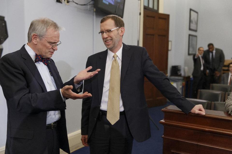 Congressional Budget Office (CBO) Director Douglas Elmendorf, right, talks with House Budget Committee member Rep. Earl Blumenauer, D-Ore. on Capitol Hill in Washington, Wednesday, Feb. 5, 2014, prior to Elmendorf testifying before the committee's hearing on the CBO budget and economic outlook. New estimates that President Barack Obama’s health care law will encourage millions of Americans to leave the workforce or reduce their work hours have touched off an I-told-you-so chorus from Republicans, who’ve claimed all along that the law will kill jobs. (AP Photo/J. Scott Applewhite)