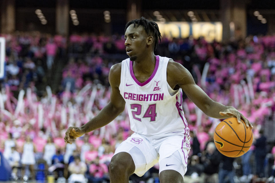 Creighton's Arthur Kaluma (24) dribbles the ball against Xavier in the second half during an NCAA college basketball game Saturday, Jan. 28, 2023, in Omaha, Neb. (AP Photo/John Peterson)