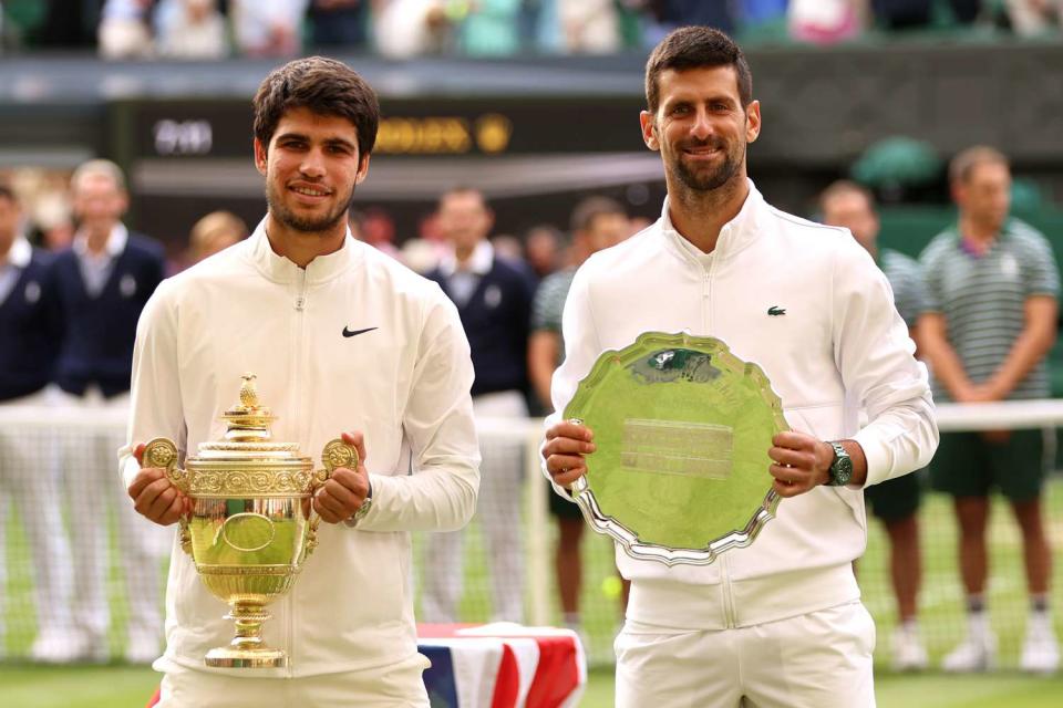 <p> Clive Brunskill/Getty Images</p> Carlos Alcaraz of Spain (left) beat Serbian player Novak Djokovic in the 2023 Wimbledon men