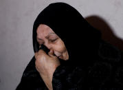 <p>Mother of a Palestinian man, Abdel-Karim Abu Jalhoum, who died with his family in the earthquake in Turkey, mourns at the family house in Beit Lahiya in northern Gaza Strip February 8, 2023. REUTERS/Mohammed Salem</p> 