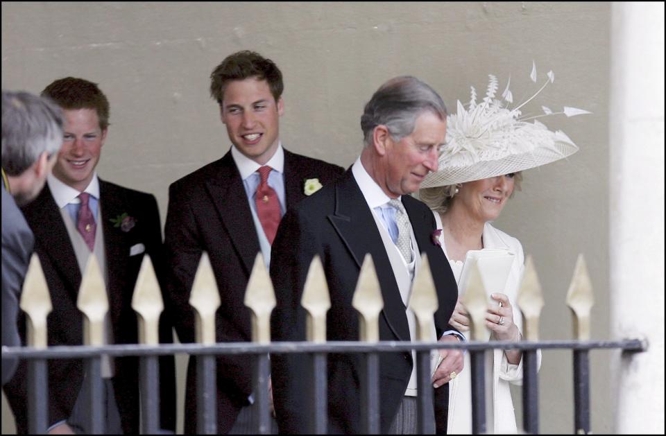 Prince Charles, the Prince of Wales, and his wife Camilla, the Duchess of Cornwall, leaving the Guildhall after the civil ceremony and followed by Princes Harry and William. (Photo by Sebastien DUFOUR/Gamma-Rapho via Getty Images)