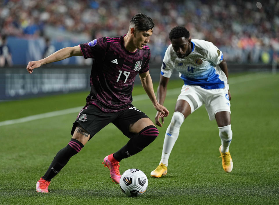 Mexico's Gerardo Arteaga (19) moves the ball against Costa Rica's Keysher Fuller (4) during the first half of a CONCACAF Nations League semifinal soccer match, Thursday, June 3, 2021, in Denver. (AP Photo/Jack Dempsey)