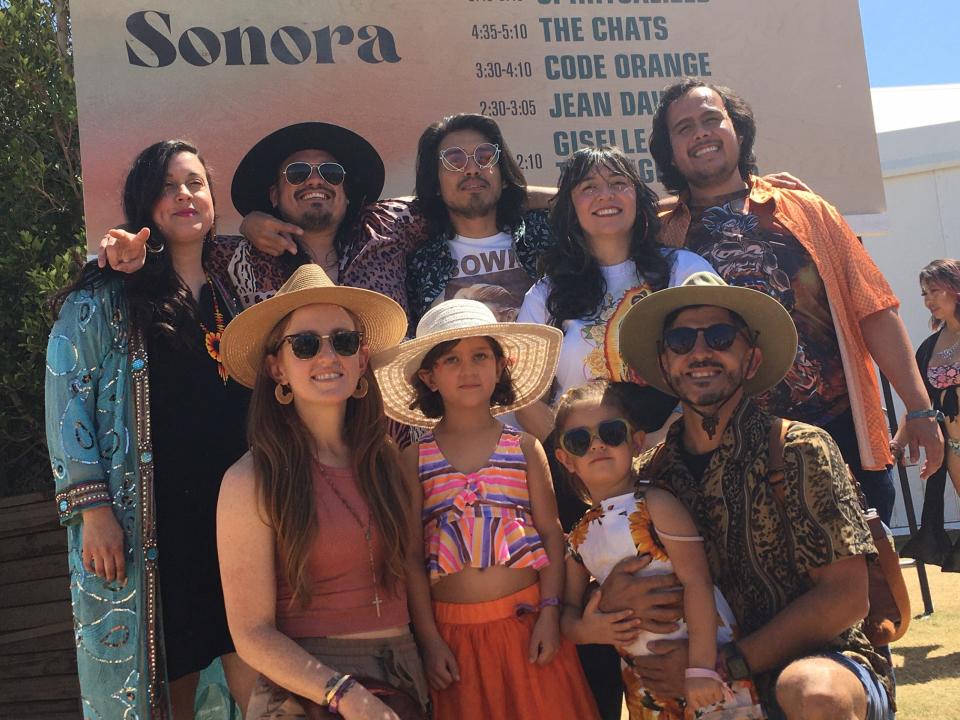 Coachella Valley native Giselle Woo (back row second from right) and her band The Night Owls invited fans to pose for photos with them after their Friday set at the Coachella Music and Arts Festival.