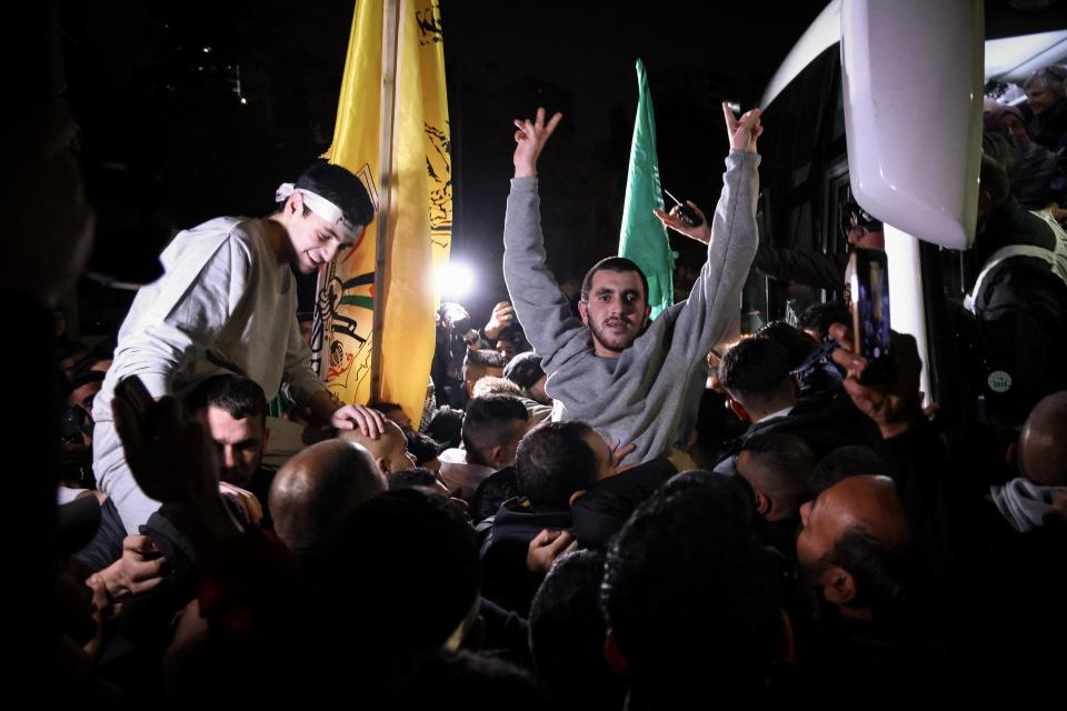 A Palestinian prisoner gestures among supporters and relatives after being released from an Israeli jail in exchange for Israeli hostages freed by Hamas from the Gaza Strip on Nov. 28, 2023.