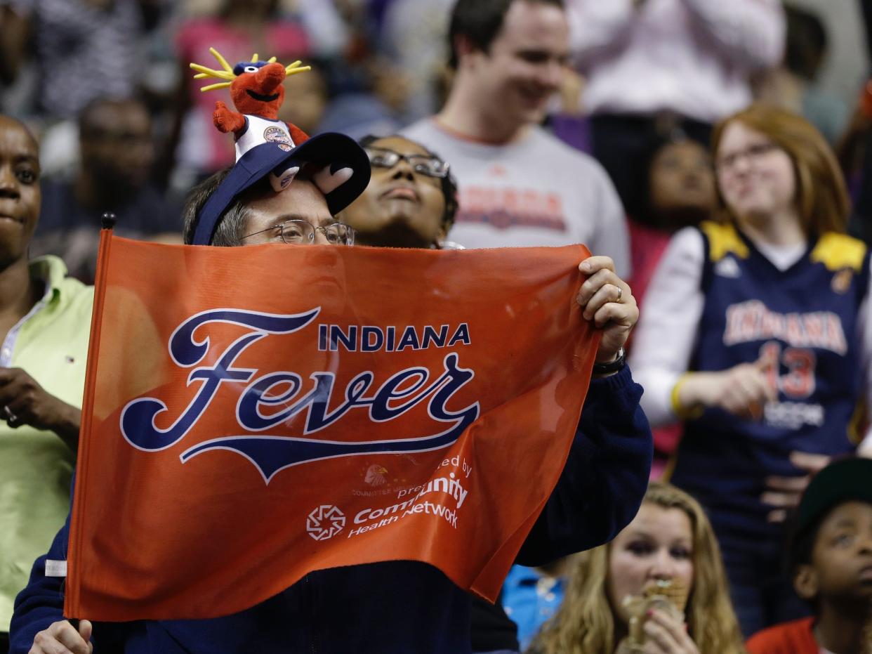 A fan cheers on the WNBA's Indiana Fever.