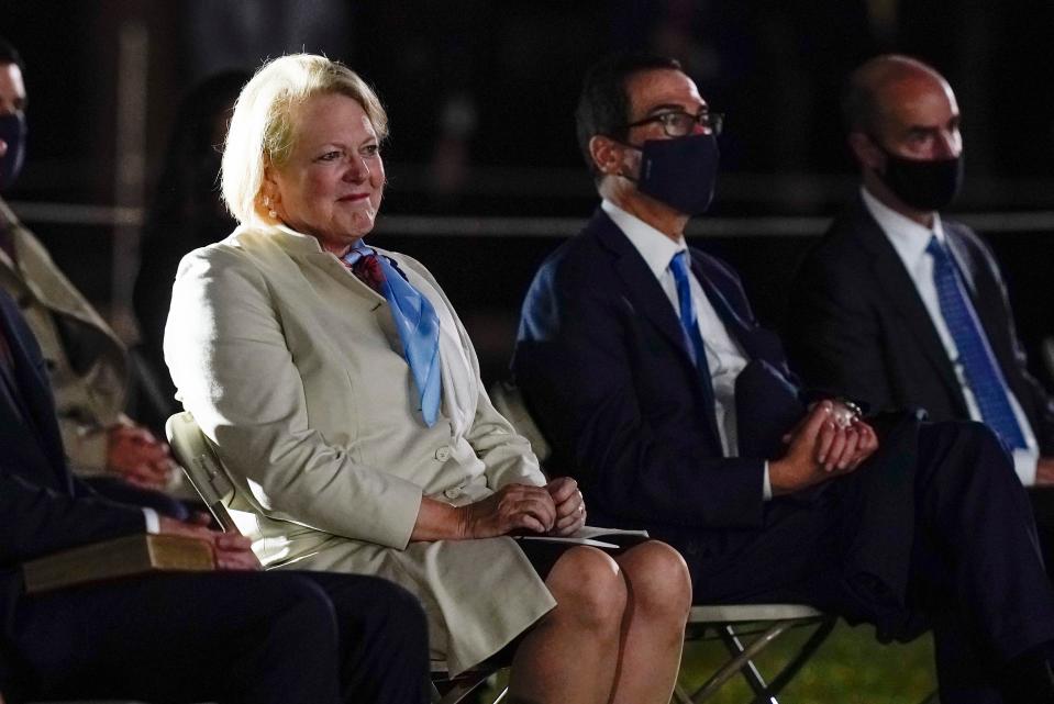 Virginia "Ginni" Thomas, wife of Supreme Court Justice Clarence Thomas, arrives to watch Amy Coney Barrett take the Constitutional Oath on the South Lawn of the White House in Washington, Monday, Oct. 26, 2020. Ginni Thomas is using her Facebook page to amplify unsubstantiated claims of corruption by Joe Biden. She is a longtime conservative activist who asked her more than 10,000 followers Oct. 26, 2020, to consider sharing a link focused on alleged corruption by Biden and his son, Hunter, as well as claims that social media companies are censoring reports about the Bidens. (AP Photo/Patrick Semansky) ORG XMIT: WX121