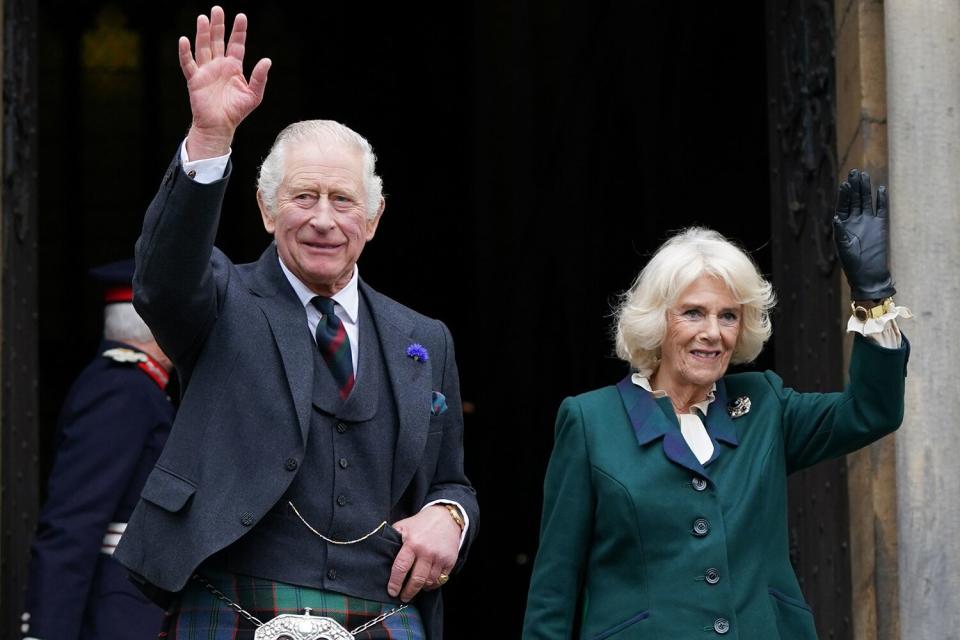 King Charles III and Camilla, Queen Consort, waves as they leave Dunfermline Abbey, after a visit to mark its 950th anniversary, and after attending a meeting at the City Chambers in Dunfermline where the King formally marked the conferral of city status on the former town on October 3, 2022 in Dunfermline, Scotland.