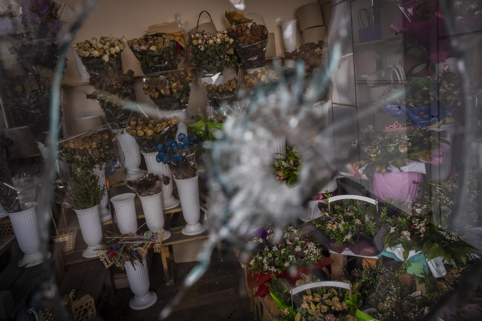 Dried flower bouquets inside a flower shop in a temporary closed market Kharkiv, eastern Ukraine, Tuesday, May 24, 2022. (AP Photo/Bernat Armangue)