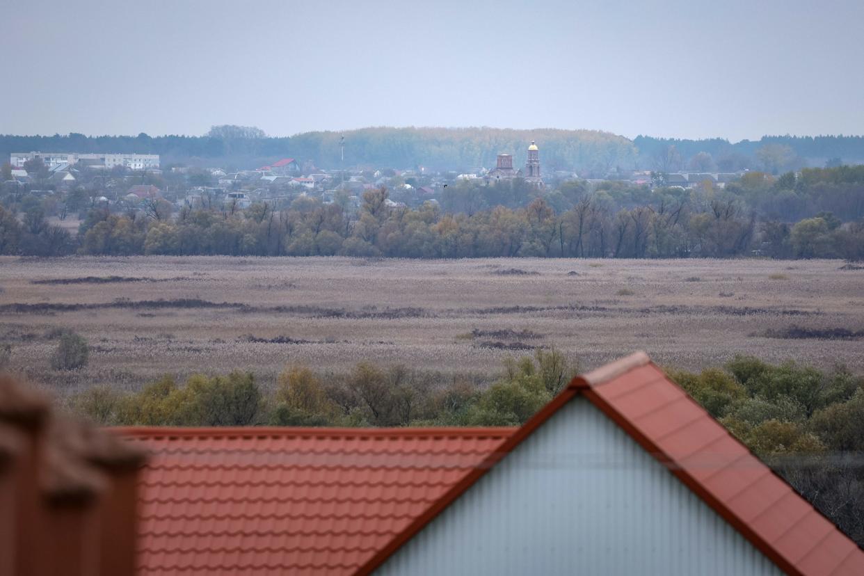 A damaged church is seen in still occupied Oleshky on the other side of the Dnipro in Kherson, Ukraine.