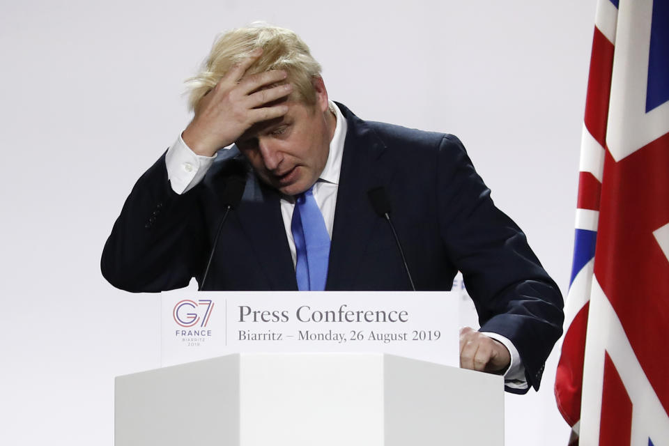 Britain's Prime Minister Boris Johnson gestures during his final press conference at the G7 summit Monday, Aug. 26, 2019 in Biarritz, southwestern France. (AP Photo/Francois Mori)