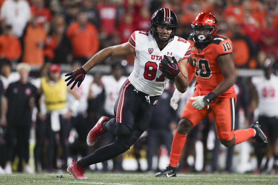 Utah tight end Thomas Yassmin (87) runs past Oregon State linebacker Andrew Chatfield Jr. (10) during the second half of an NCAA college football game Friday, Sept. 29, 2023, in Corvallis, Ore. | Amanda Loman, Associated Press