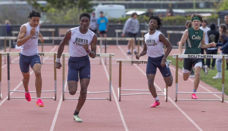 Toms River North Mamadi Diawara heads for finish line and first place win in the 3X400 hurdles. Ocean County Track and Field Relays in Stafford Township on May 5, 2023.