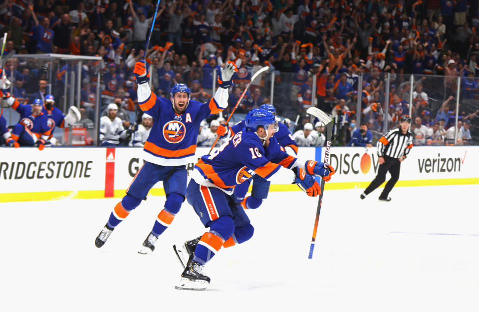 UNIONDALE, NEW YORK - JUNE 23: Anthony Beauvillier #18 of the New York Islanders celebrates after scoring the game-winning goal during the first overtime period against the Tampa Bay Lightning in Game Six of the Stanley Cup Semifinals during the 2021 Stanley Cup Playoffs at Nassau Coliseum on June 23, 2021 in Uniondale, New York. (Photo by Bruce Bennett/Getty Images)