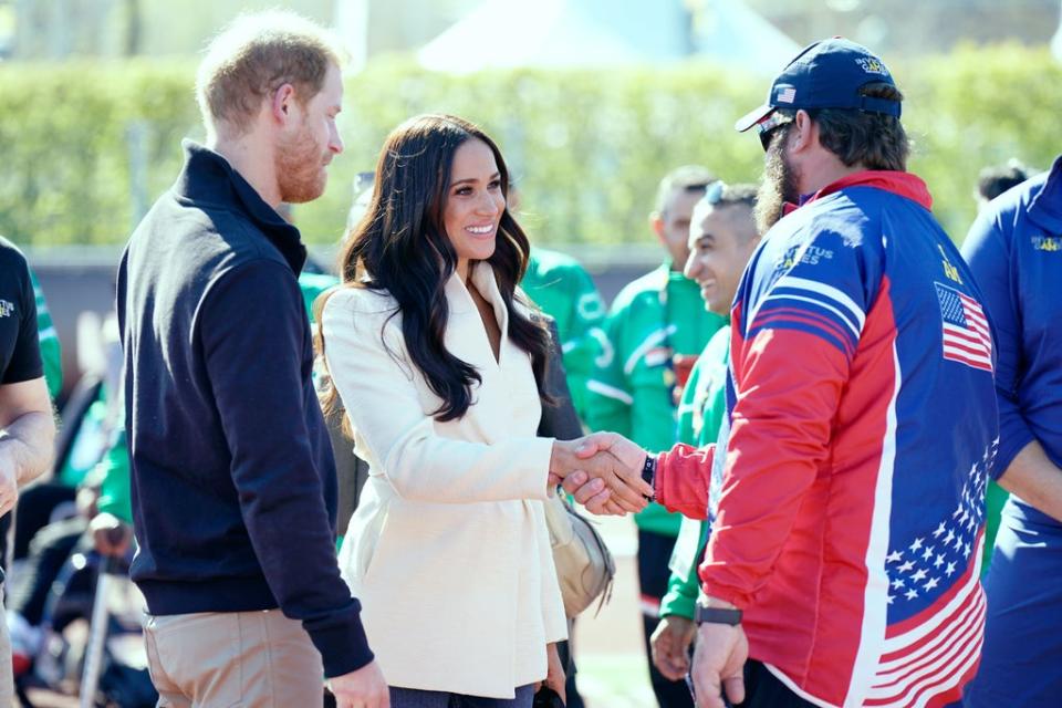 The couple met US competitors while at the athletics track (Aaron Chown/PA) (PA Wire)