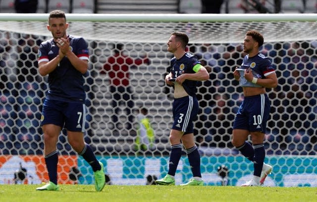 John McGinn (left) and his team-mates reflect on their opening defeat 