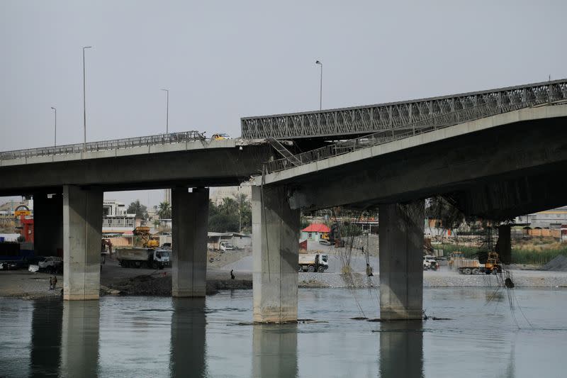 A view of a bridge which was destroyed during the war against Islamic State militants in Mosul