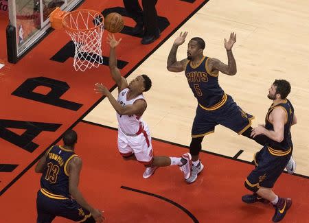 May 21, 2016; Toronto, Ontario, CAN; Toronto Raptors guard Kyle Lowry (7) drives to the basket as Cleveland Cavaliers guard J.R. Smith (5) tries to defend in game three of the Eastern conference finals of the NBA Playoffs at Air Canada Centre. Mandatory Credit: Nick Turchiaro-USA TODAY Sports