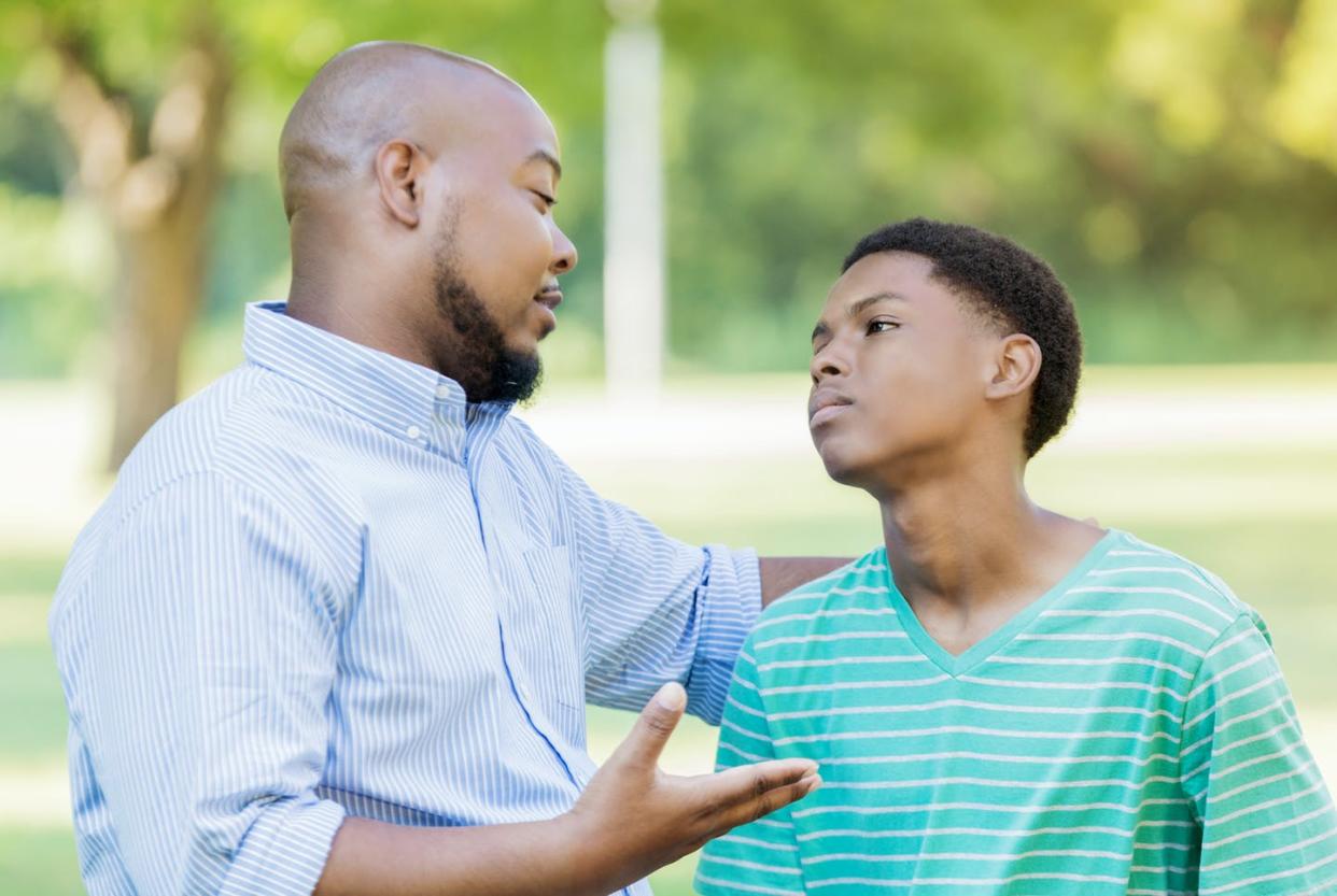 <span class="caption">Discussing violence with children can be challenging for a parent.</span> <span class="attribution"><a class="link " href="https://www.gettyimages.com/detail/photo/father-disciplines-teenage-son-with-extra-chores-royalty-free-image/855227518?adppopup=true" rel="nofollow noopener" target="_blank" data-ylk="slk:SDI Productions/E+ via Getty Images;elm:context_link;itc:0;sec:content-canvas">SDI Productions/E+ via Getty Images</a></span>