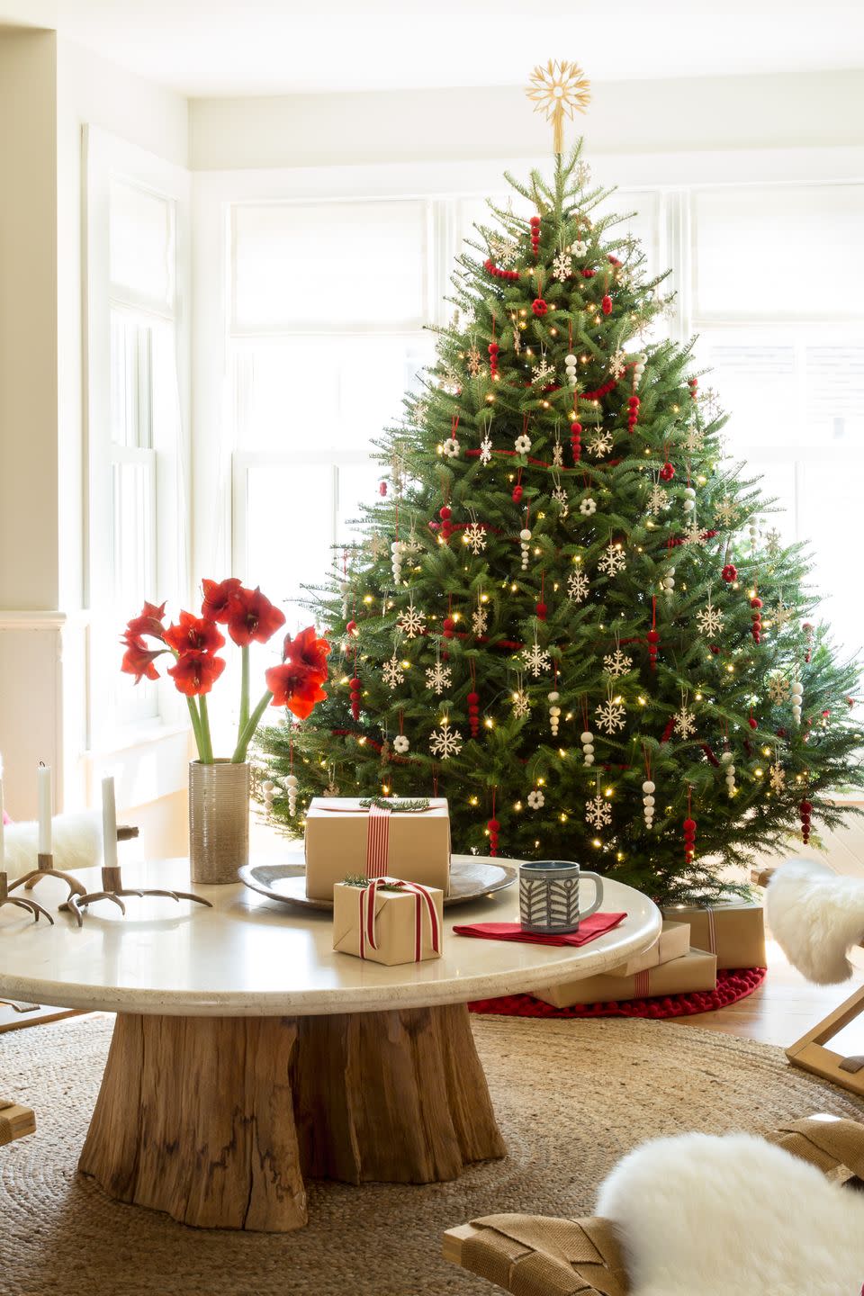 <p>Finnish birch and felt ornaments trim the tree in this Wisconsin home.</p><p><a class="link " href="https://www.amazon.com/eZAKKA-Christmas-Ornaments-Embellishments-Decorations/dp/B01N7BM38U/ref=sxin_9_ac_d_rm?ac_md=3-3-d29vZGVuIG9ybmFtZW50cyBmb3IgY2hyaXN0bWFzIHRyZWU%3D-ac_d_rm&cv_ct_cx=wooden+snowflake+ornaments&dchild=1&keywords=wooden+snowflake+ornaments&pd_rd_i=B01N7BM38U&pd_rd_r=610e3624-c580-41e2-bd2c-374be64f4eaf&pd_rd_w=Uvnew&pd_rd_wg=yHDok&pf_rd_p=3d1a8341-be16-45b1-ae3d-ba8c533ec9f0&pf_rd_r=K512YBYNMGDWJNED0A00&psc=1&qid=1603207745&sr=1-4-12d4272d-8adb-4121-8624-135149aa9081&tag=syn-yahoo-20&ascsubtag=%5Bartid%7C10050.g.1251%5Bsrc%7Cyahoo-us" rel="nofollow noopener" target="_blank" data-ylk="slk:SHOP WOODEN ORNAMENTS;elm:context_link;itc:0;sec:content-canvas">SHOP WOODEN ORNAMENTS</a></p>