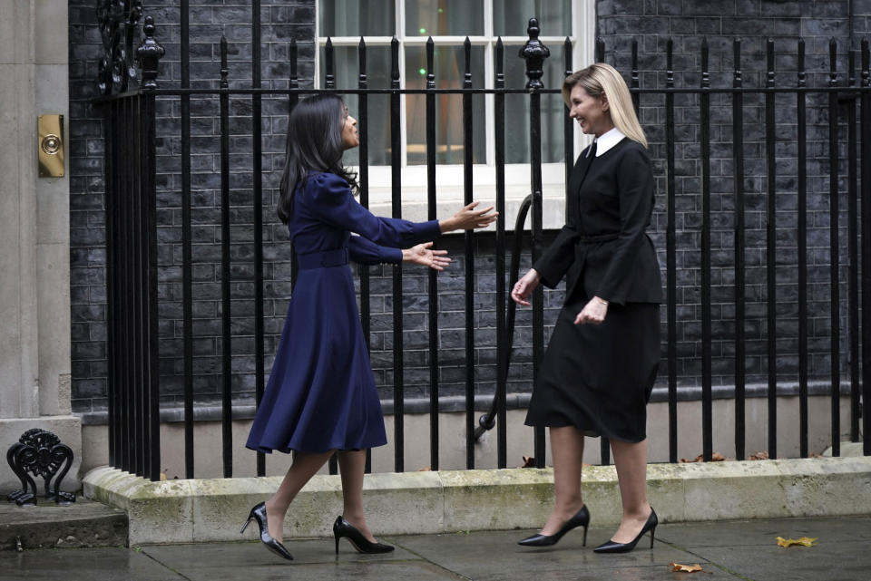 First Lady of Ukraine Olena Zelenska, right, is greeted by Rishi Sunak's wife Akshata Murty outside 10 Downing Street in London, Monday Nov. 28, 2022, during her visit to the UK. (Yui Mok/PA via AP)