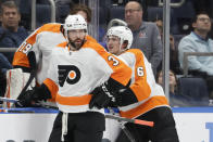 Philadelphia Flyers defensemen Keith Yandle (3) and Travis Sanheim (6) look on during a time out in the third period of an NHL hockey game against the New York Islanders, Tuesday, Jan. 25, 2022, in Elmont, N.Y. (AP Photo/Corey Sipkin).