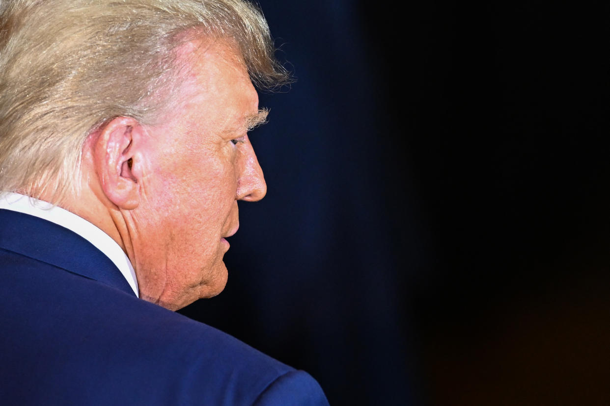 Former President Donald Trump arrives at a press conference.