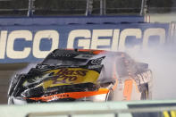 Race leader Noah Gragson (9) limps along the track after having made contact with David Starr with two laps to go in a NASCAR Xfinity Series auto race, Saturday, Feb. 27, 2021, in Homestead, Fla. (AP Photo/Wilfredo Lee)