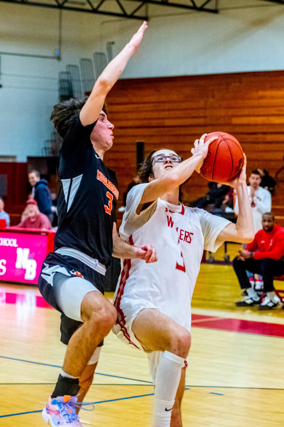New Bedford's Craig Baptista drives to the basket.