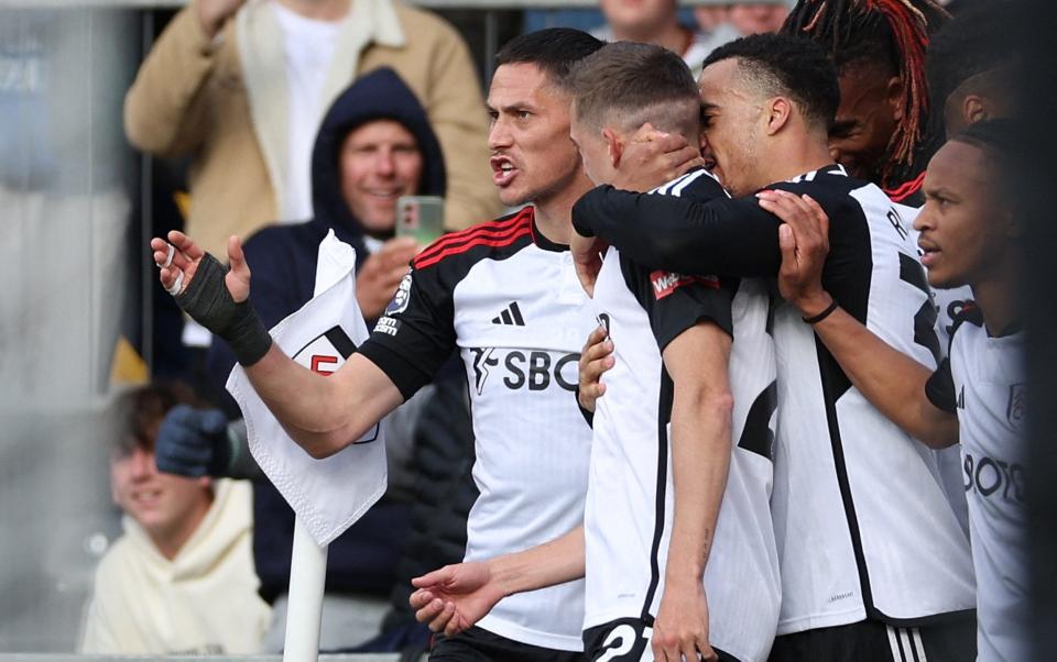 Fulham players celebrate their equaliser