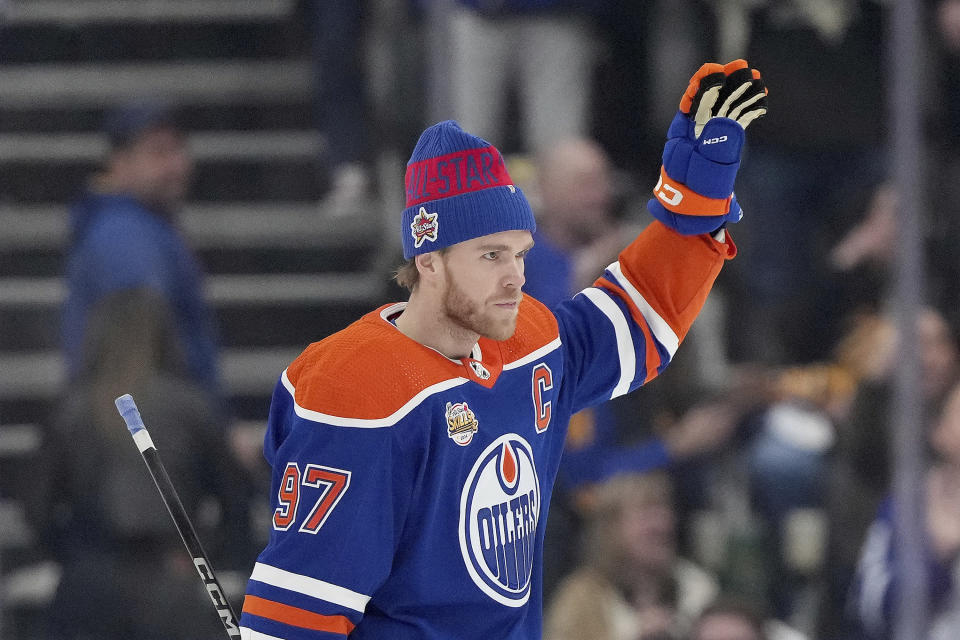 Edmonton Oilers' Connor McDavid acknowledges the crowd after being crowned winner of the NHL All-Star hockey skills competition in Toronto, Friday, Feb. 2, 2024. (Nathan Denette/The Canadian Press via AP)