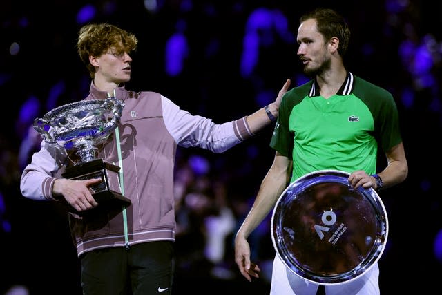 Jannik Sinner, left, consoles Daniil Medvedev 