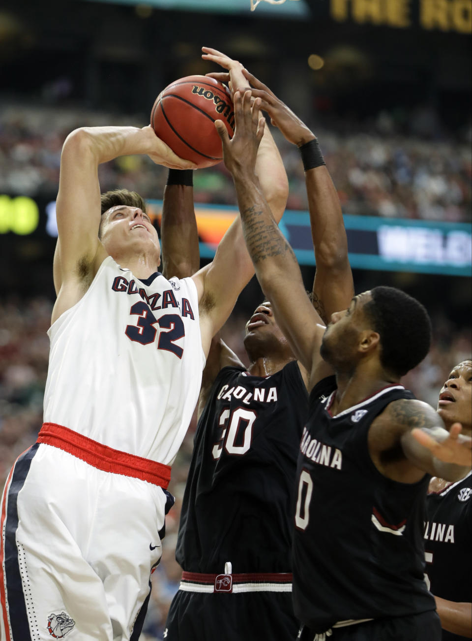 South Carolina's Chris Silva (30) and Sindarius Thornwell (0) block a shot by Gonzaga's Zach Collins (32) during the second half in the semifinals of the Final Four NCAA college basketball tournament, Saturday, April 1, 2017, in Glendale, Ariz. (AP Photo/Mark Humphrey)