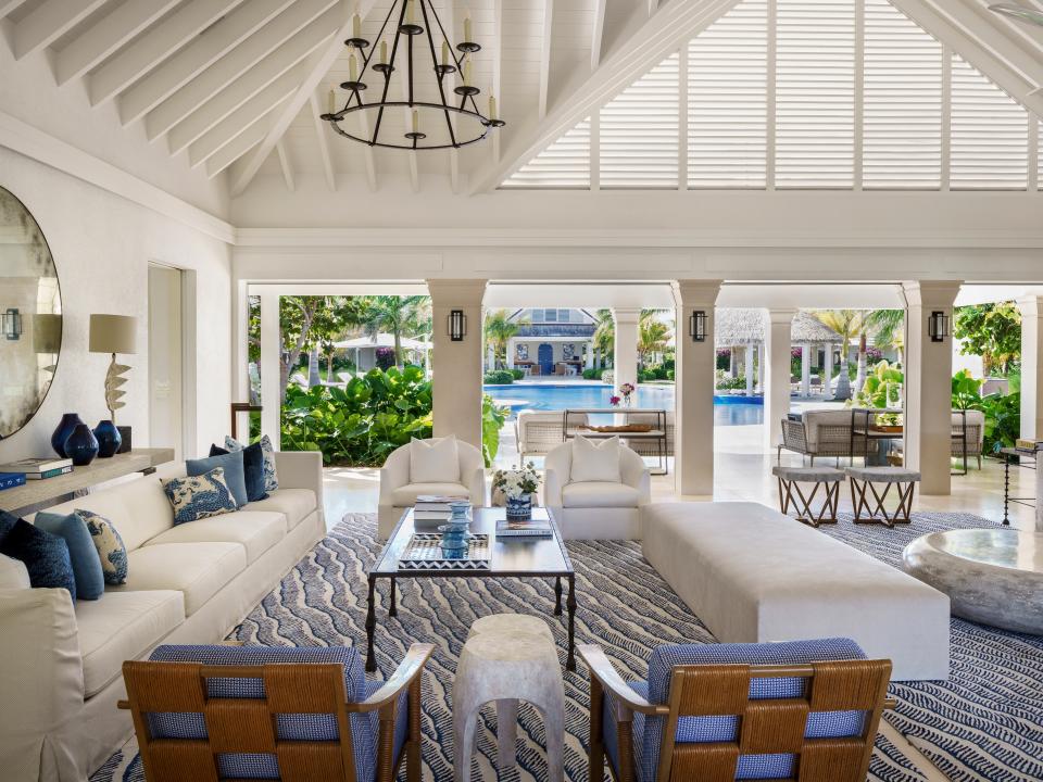 The great room of a beach estate on the private island of Jumby Bay, off the coast of Antigua, was designed by Studio IDC to blend seamlessly with its location.