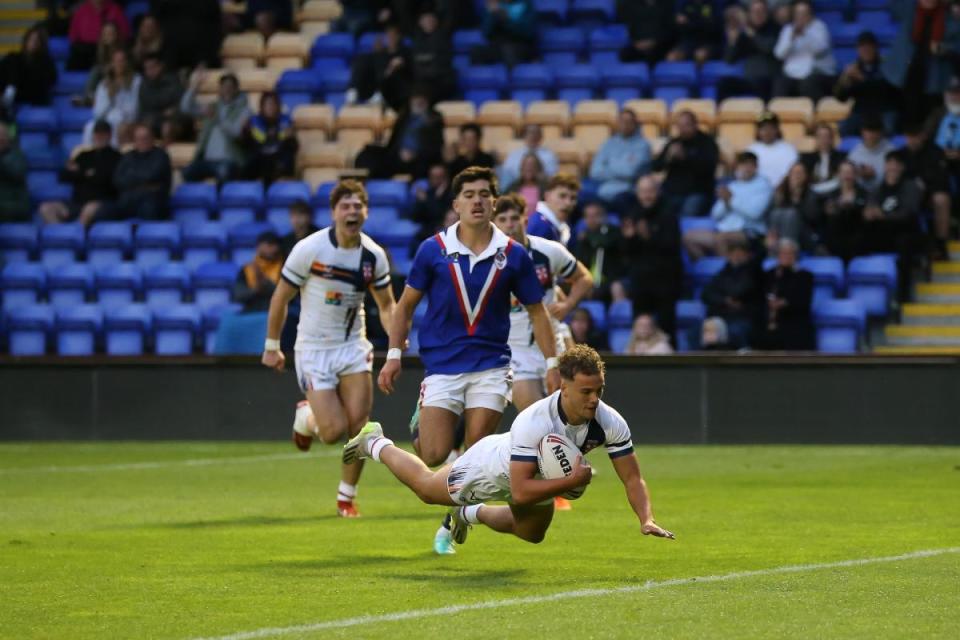 Cai Taylor-Wray scores the second of his two tries for England Academy at The Halliwell Jones Stadium <i>(Image: John Baldwin Photography)</i>
