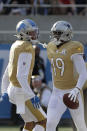 NFC wide receiver Amari Cooper, of the Dallas Cowboys (19), right, celebrates his touchdown with wide receiver Kenny Golladay, of the Detroit Lions (19), during the first half of the NFL Pro Bowl football game against the AFC, Sunday, Jan. 26, 2020, in Orlando, Fla. (AP Photo/Chris O'Meara)