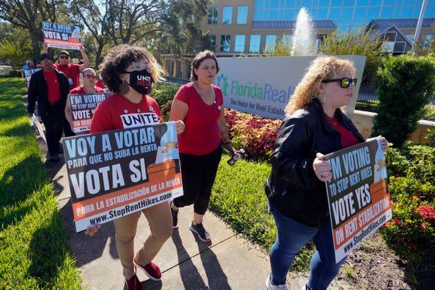 Rent control advocates for Orange County demonstrate in front of a Florida real estate office on Oct. 22, 2022, in Orlando.