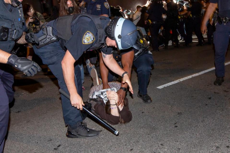 NYPD officers detain a protester outside FIT in Manhattan on May 7, 2024. NY Post