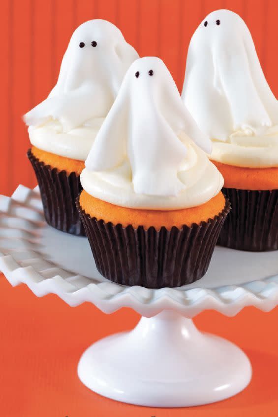 <p>These sweet treats are deliciously spooky — and easy to make! Just use store-bought cake mix and whisk together a quick, creamy marshmallow frosting.</p><p><em><a href="https://www.womansday.com/food-recipes/food-drinks/a28834832/ghost-cupcakes-recipe/" rel="nofollow noopener" target="_blank" data-ylk="slk:Get the recipe from Woman's Day »;elm:context_link;itc:0;sec:content-canvas" class="link ">Get the recipe from Woman's Day »</a></em></p>